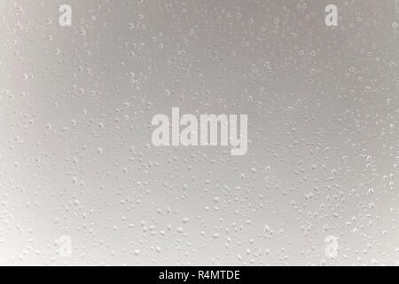 Water drops background in big dimension. Rain drops on the window surface, grayish color tone Stock Photo