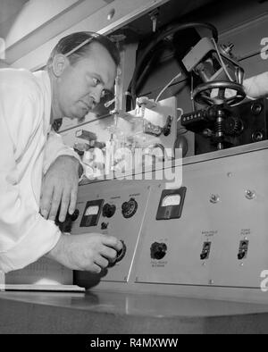 A technician work at an American Cancer Society Research Center at UCLA in Southern California, ca. 1959. Stock Photo