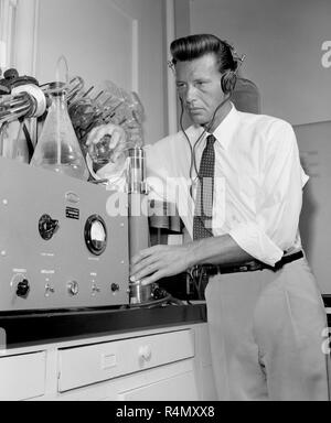 A technician work at an American Cancer Society Research Center at UCLA in Southern California, ca. 1959. Stock Photo