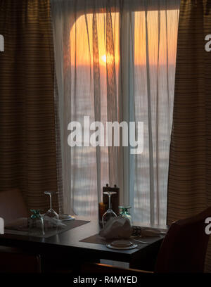 Table for two in shipboard restaurant by window Stock Photo