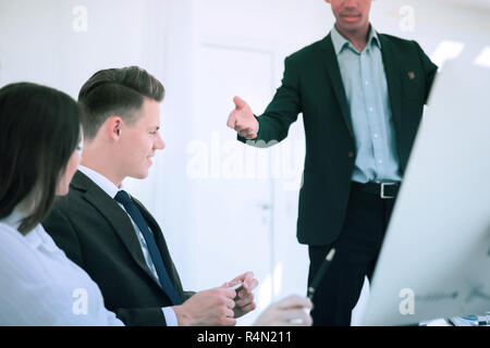 colleagues discussing new ideas in the office Stock Photo