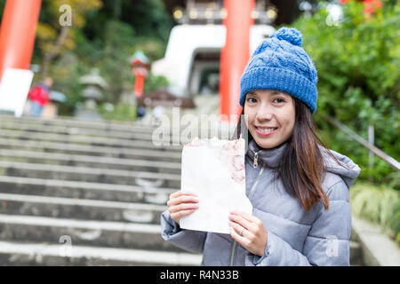 Woman holding cracker in Enoshima Stock Photo