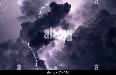 Lightning and storm clouds in sky Stock Photo