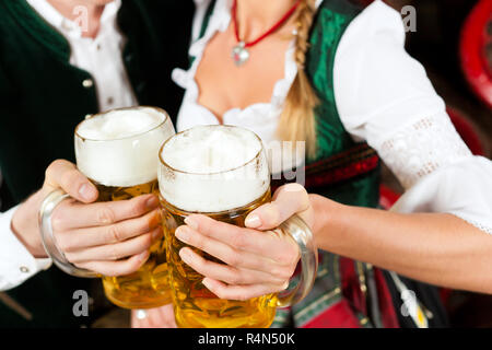 Couple drinking beer in brewery Stock Photo