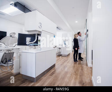 Dentist and assistant in corridor Stock Photo