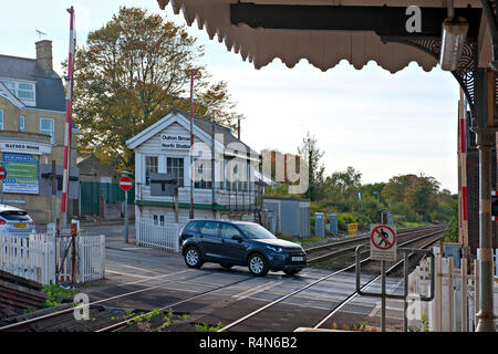 Oulton Broad North Signal Box and crossing, Suffolk, Barriers are up to allow road traffic to cross. Stock Photo