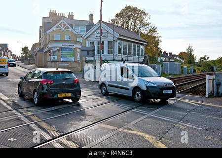 Oulton Broad North Signal Box and crossing, Suffolk, Barriers are up to allow road traffic to cross. Stock Photo