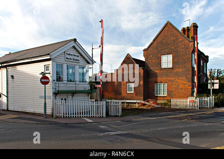 Oulton Broad North Signal Box and crossing, Suffolk, Barriers are up to allow road traffic to cross. Stock Photo