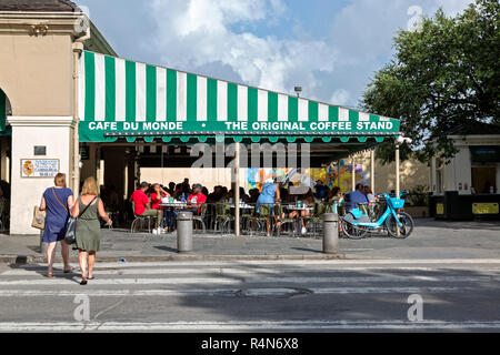 Street view of the popular Cafe du Monde, in New Orleans, Louisiana, crowded with tourists, even in the summer.