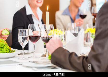 Table with wine at business lunch in restaurant