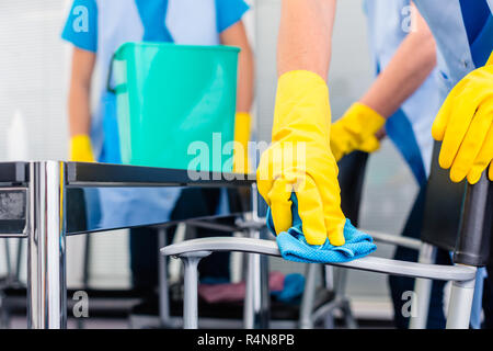 Cleaning ladies working as team in office Stock Photo