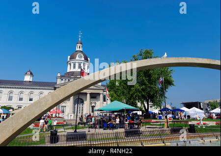 Confederation Park and City Hall, with part of the Confederation Arch in the foreground. Kingston, Ontario, Canada. Stock Photo