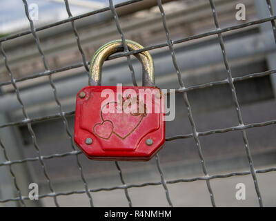 A rusty, red padlock. Stock Photo