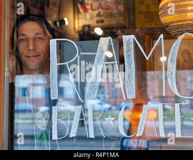 Berlin, Germany. 26th Nov, 2018. Flo Hayler, operator of the Ramones Museum, shows his book 'Ramones - A Life Story' through the disc. Hayler goes on a reading tour in Germany in December. (to dpa 'A Life with the Ramones: Expert Hayler Brings Punkrock Tomes Out' from 28.11.2018) Credit: Annette Riedl/dpa/Alamy Live News Stock Photo