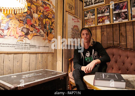 Berlin, Germany. 26th Nov, 2018. Flo Hayler, operator of the Ramones Museum and author of the book 'Ramones - A Life Story' sits in his museum. Hayler goes on a reading tour in Germany in December. (to dpa 'A Life with the Ramones: Expert Hayler Brings Punkrock Tomes Out' from 28.11.2018) Credit: Annette Riedl/dpa/Alamy Live News Stock Photo