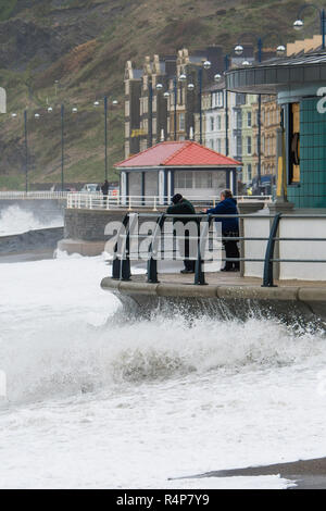 Aberystwyth Wales UK, 28th Nov 2018. UK Weather : Storm Diana, with strengthening winds gusting up to 60 or 70mph, continues to throw huge waves against the sea defences in Aberystwyth on the Cardigan Bay coast of west Wales. The UK Met Office has issued a yellow warning for wind today and tomorrow for western part of the British Isles, with the risk of damage to property and likely disruption to travel.  photo credit Keith Morris / Alamy Live News Stock Photo