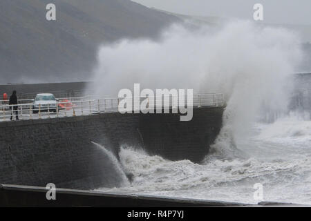 Aberystwyth Wales UK, 28th Nov 2018. UK Weather : Storm Diana, with strengthening winds gusting up to 60 or 70mph, continues to throw huge waves against the sea defences in Aberystwyth on the Cardigan Bay coast of west Wales. The UK Met Office has issued a yellow warning for wind today and tomorrow for western part of the British Isles, with the risk of damage to property and likely disruption to travel.  photo credit Keith Morris / Alamy Live News Stock Photo