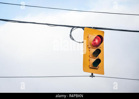 Traffic light abiding by American standard regulations taken at a crossroad in Ottawa, Ontario, Canada, indicating red light for cars  Picture of  an  Stock Photo