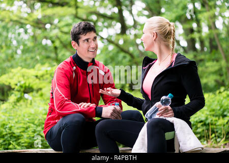 Couple having rest during jogging sport Stock Photo