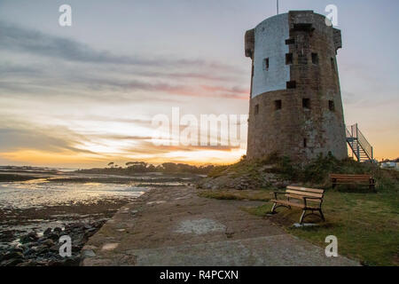 Le Hoq, Bailiwick of Jersey, Channel Islands, UK. The Le Hoq Tower was built in the 1780s after the French attack on the island  and Battle of Jersey. Stock Photo
