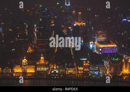 Beautiful super wide-angle night aerial view of Shanghai, China with Waitan, The Bund and scenery beyond the city, seen from the observation deck of O Stock Photo