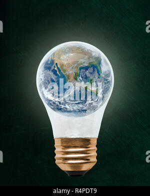 Planet earth inside floating light bulb with copy space. Concept of ...