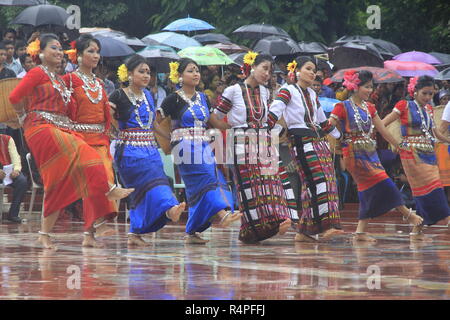 Tribal performers from Rangamati wearing traditional costume and performing a traditional dance at the Central Shaheed Minar in Dhaka on marking the I Stock Photo