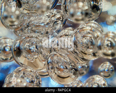 Illuminated Bubbles Floating in Clear Liquid. Abstract Background Texture. Space, Ecology, Environment, Clean Sea, Potable Water Concept. Stock Photo