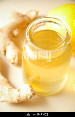 Ginger syrup with orange in glass bottle Stock Photo