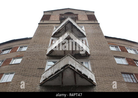 Triangular balconies of the constructivist dwelling complex nicknamed the Horseshoe House in Ivanovo, Russia. The apartment building designed by Soviet modernist architect Alexander Panov was built in 1933-1934 in Gromoboya Street as a dwelling complex for the staff of the OGPU, secret police of the Soviet Union from 1923 to 1934, later known as the NKVD and the KGB. ATTENTION: This image is a part of a photo essay of 35 photos featuring Soviet constructivist architecture in Ivanovo. Stock Photo