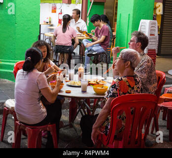 Family Having Dinner At Sidewalk Restaurant At Night Ipoh Malaysia Stock Photo Alamy