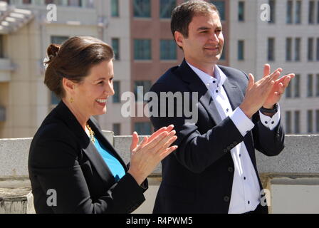 Oakland Athletics president Dave Kaval, left, talks to Reggie