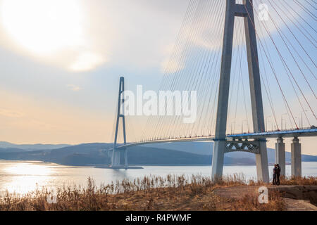 Suspended cable Russian bridge from the mainland of the Far-Eastern city of Vladivostok to the Russky island through the Eastern Bosphorus Strait. Stock Photo