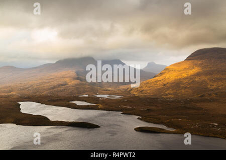 View of the hills of Coigach from Knockan Crag, NW Highlands of Scotland. The top of Cul Beag on the left is hidden in the clouds. Stock Photo