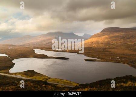 View of the hills of Coigach from Knockan Crag, NW Highlands of Scotland. The top of Cul Beag on the left is hidden in the clouds. Stac Polly can be s Stock Photo