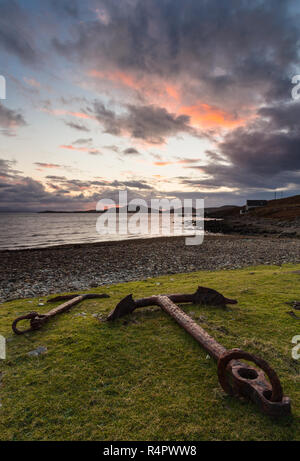 Old rusted anchors on the grass above the beach at Polbain, Coigach in the North-West Highlands of Scotland. Stock Photo