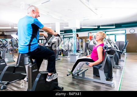 Seniors sport exercising in gym in circle training Stock Photo