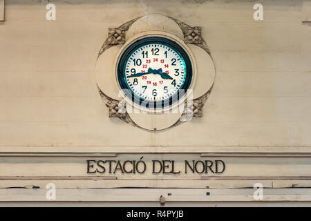 An old vintage clock on the wall at the Nord Train station in Valencia, Spain (Estacion del Norte. Stock Photo