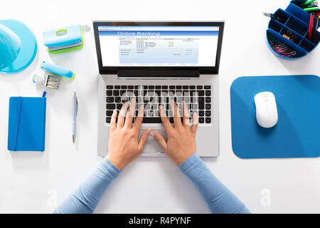 Woman Doing Online Banking On Laptop Stock Photo
