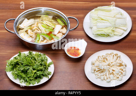 Prepared hot pot of seafood in Vietnamese style with mushroom, fish sauce Stock Photo