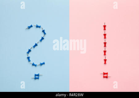 question and exclamation marks on pastel background Stock Photo