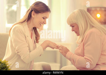 Happy good looking woman showing her hand Stock Photo