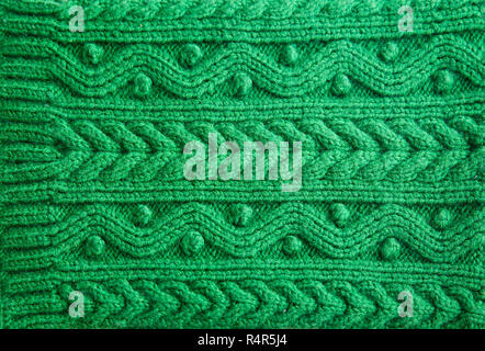 Knitted green pattern wool sweater texture close up Stock Photo