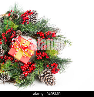 Christmas Wreath Made of Naturalistic Looking Pine Branches Decorated with Winter Berries and Pine Cones Stock Photo