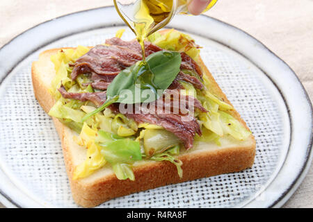 Sandwich of beef and cabbage with oil Stock Photo