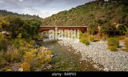 Side view of the bridgeport Covered Bridge at South Yuba River in California, USA, in the autumn. This bridge has the longest clear span of any surviv Stock Photo