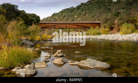 Side view of the bridgeport Covered Bridge at South Yuba River in California, USA, featuring the fall colors in the river. This bridge has the longest Stock Photo