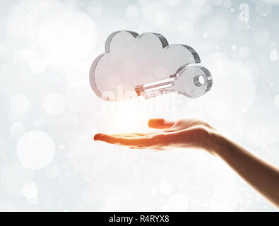 Cloud computing concept with glass symbol shown in hand Stock Photo