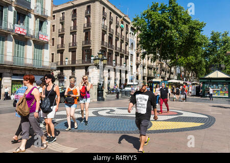 BARCELONA, SPAIN - SEPTEMBER 2: Joan Miro's Pla de l'Os mosaic in La Rambla on September 2, 2017 in Barcelona, Spain. Thousands of people walk daily o Stock Photo