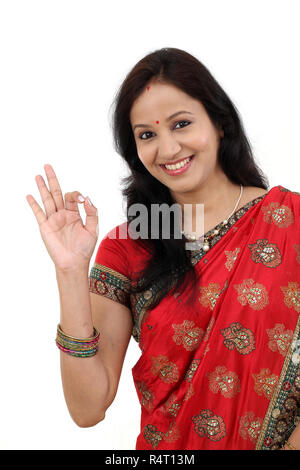 Happy traditional Indian woman making ok gesture Stock Photo